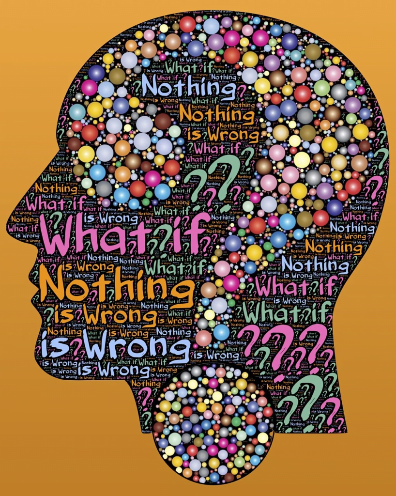  Head silhouette with colorful bubbles and 'What if?' text, depicting adult ADHD thought patterns.