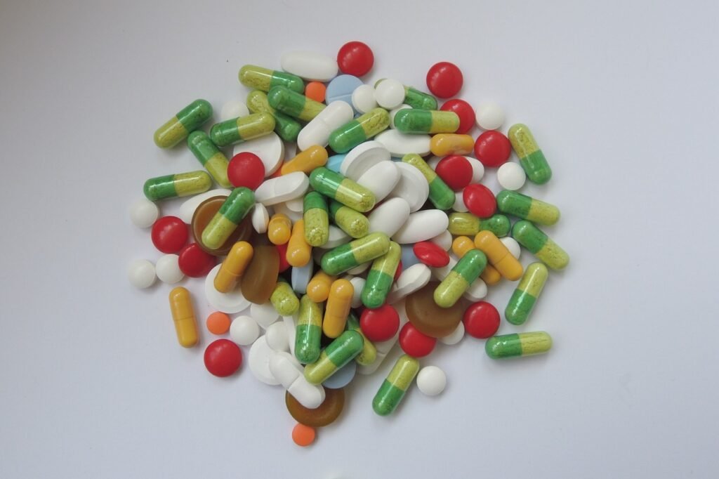 Various anxiety medications in pill and capsule form on a white background.